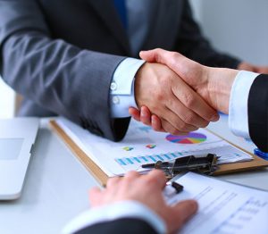 Shaking hands on another successful nuclear engineering pre-operations project handover, from COMS to the end user.